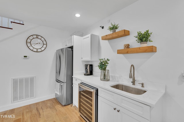 2040 Happy Valley Rd, Limestone, TN 37681 - kitchen featuring open shelves, a sink, freestanding refrigerator, wine cooler, and visible vents