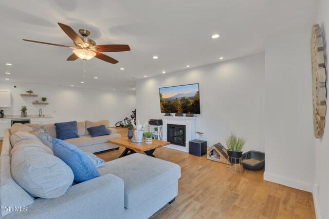 2040 Happy Valley Rd, Limestone, TN 37681 - living room featuring recessed lighting, a ceiling fan, a glass covered fireplace, and light wood-type flooring