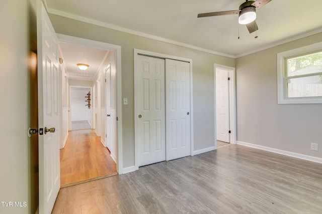 112 Fairwood St, Kingsport, TN 37660 - unfurnished bedroom featuring ornamental molding, light wood-style floors, a closet, baseboards, and ceiling fan