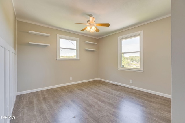 112 Fairwood St, Kingsport, TN 37660 - spare room featuring baseboards, wood finished floors, ceiling fan, and crown molding