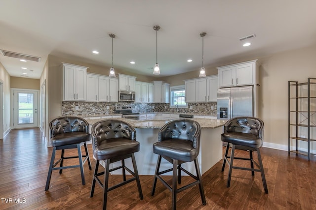 1447 Lemongrass Dr, Jonesborough, TN 37659 - kitchen featuring appliances with stainless steel finishes, visible vents, and backsplash