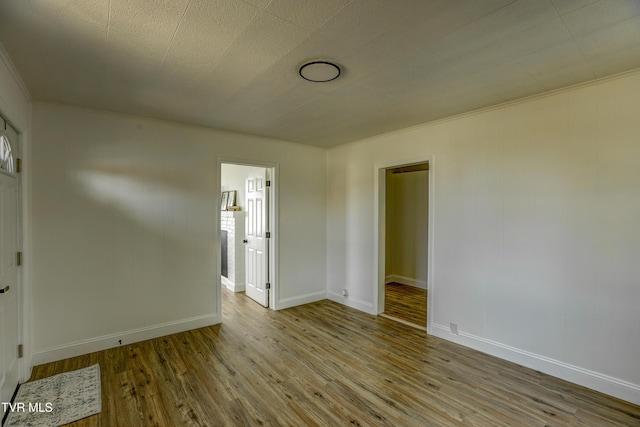 908 Columbia Rd, Bristol, TN 37620 - unfurnished room with wood finished floors, crown molding, and baseboards