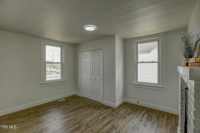 908 Columbia Rd, Bristol, TN 37620 - unfurnished bedroom with a closet, wood finished floors, visible vents, and baseboards