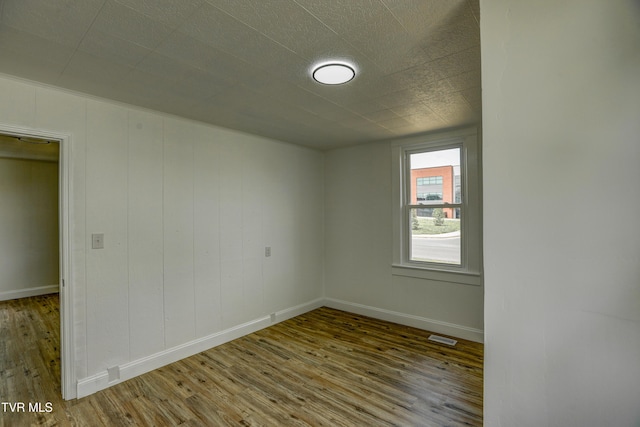 908 Columbia Rd, Bristol, TN 37620 - empty room with baseboards, wood finished floors, and visible vents