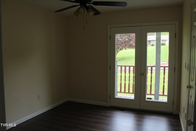 entryway featuring french doors, baseboards, dark wood-type flooring, and a ceiling fan