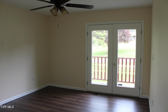 entryway featuring french doors, dark wood finished floors, baseboards, visible vents, and ceiling fan