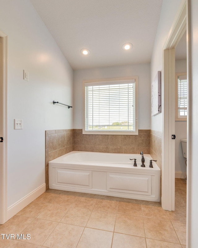 full bathroom featuring a garden tub, tile patterned flooring, and recessed lighting