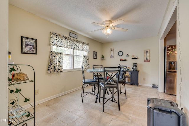 226 Delaney St, Bristol, TN 37620 - dining area featuring a textured ceiling, baseboards, ceiling fan, and light tile patterned floors