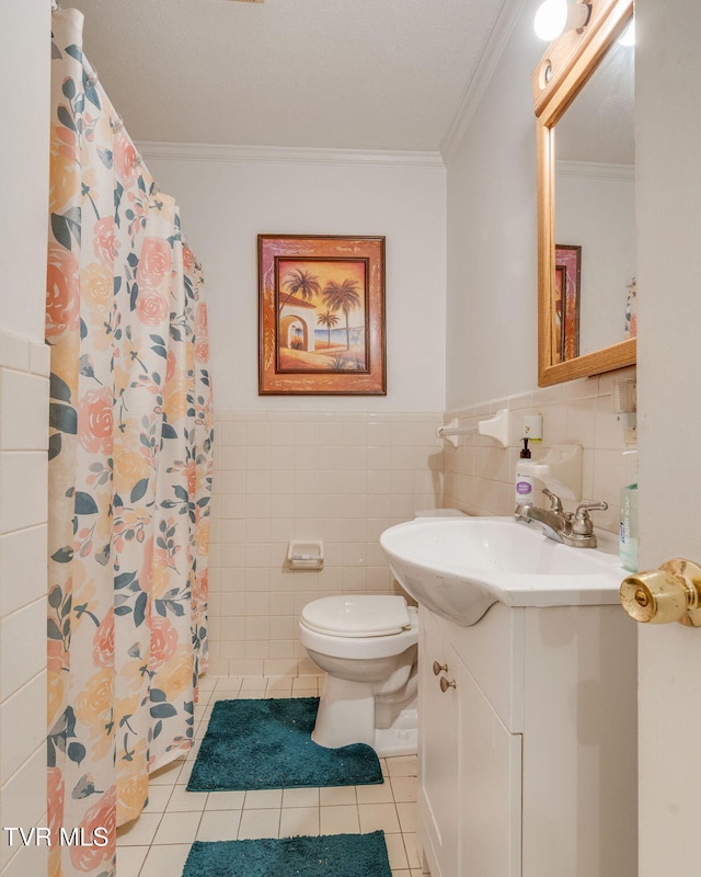 226 Delaney St, Bristol, TN 37620 - bathroom featuring vanity, tile walls, toilet, ornamental molding, and tile patterned flooring
