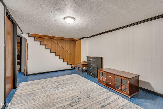 226 Delaney St, Bristol, TN 37620 - finished basement featuring baseboards, a textured ceiling, crown molding, and stairs