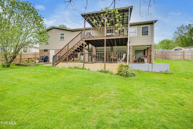226 Delaney St, Bristol, TN 37620 - rear view of house with a wooden deck, a lawn, stairway, and fence