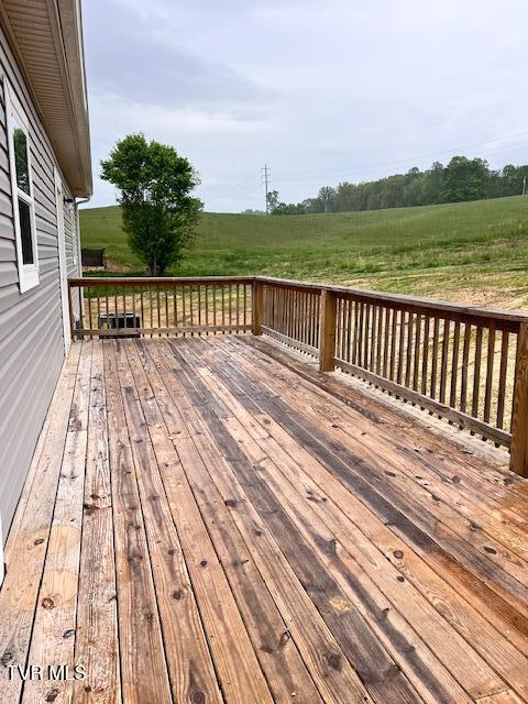 wooden terrace with a rural view