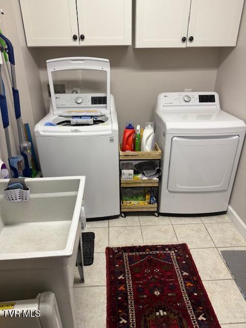 211 Michaels Ridge Blvd, Gray, TN 37615 - washroom with light tile patterned flooring, cabinet space, and washer and clothes dryer