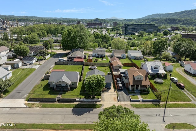 drone / aerial view featuring a residential view and a mountain view
