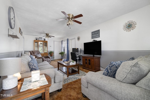living room with carpet floors and a ceiling fan