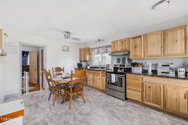 kitchen with visible vents, light brown cabinetry, ceiling fan, under cabinet range hood, and stainless steel electric range oven