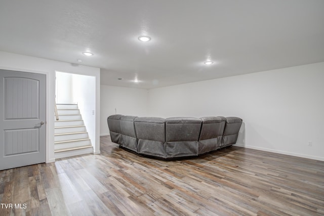 living area featuring wood finished floors, recessed lighting, and baseboards
