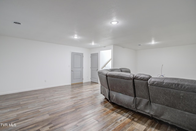 living area featuring wood finished floors, recessed lighting, and baseboards
