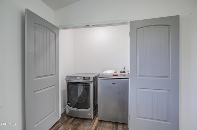 clothes washing area featuring washing machine and dryer and dark wood-style floors