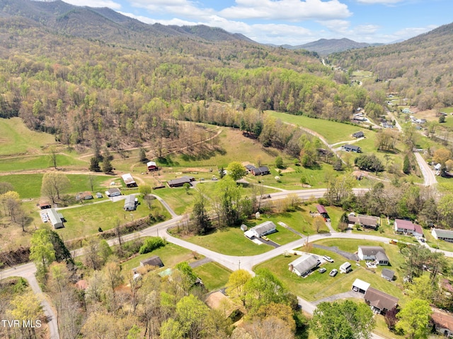 aerial view featuring a mountain view and a forest view
