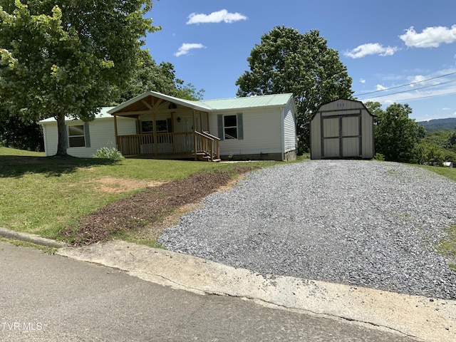 1014 Red Bud Ln, Rogersville, TN 37857 - manufactured / mobile home with covered porch, a front yard, driveway, and metal roof