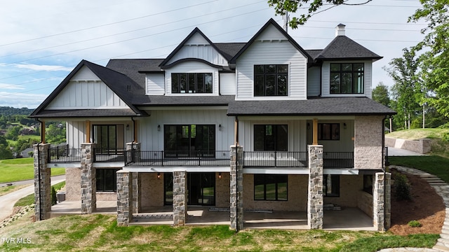 1093 Hawk Nest Ct, Jonesborough, TN 37659 - back of property with a patio area, board and batten siding, a balcony, and a shingled roof
