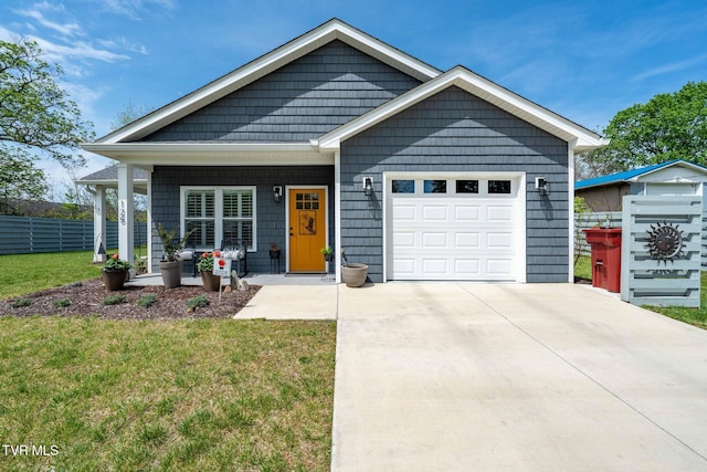 125 Lynn Rd, Johnson City, TN 37604 - view of front of home featuring driveway, covered porch, fence, a garage, and a front yard