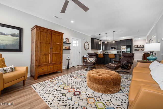 125 Lynn Rd, Johnson City, TN 37604 - living room featuring light wood finished floors, visible vents, recessed lighting, a ceiling fan, and crown molding