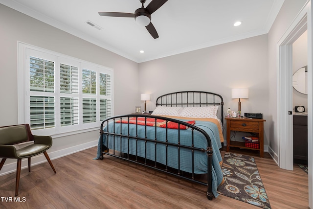 125 Lynn Rd, Johnson City, TN 37604 - bedroom with baseboards, visible vents, recessed lighting, wood finished floors, and crown molding