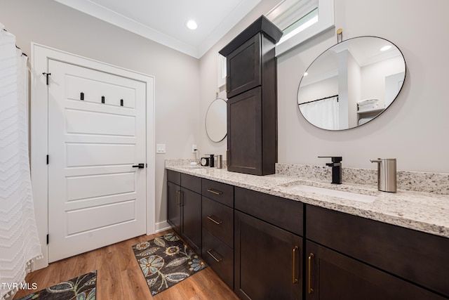 125 Lynn Rd, Johnson City, TN 37604 - bathroom featuring ornamental molding, wood finished floors, a sink, and double vanity