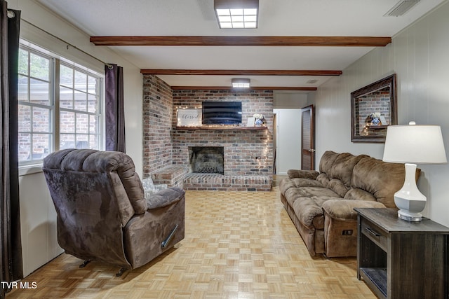 103 Dogwood Ln, Johnson City, TN 37604 - living room featuring beamed ceiling, a brick fireplace, visible vents, and a wealth of natural light