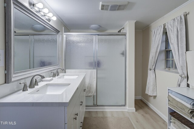 103 Dogwood Ln, Johnson City, TN 37604 - bathroom with wood finished floors, a sink, visible vents, and a stall shower