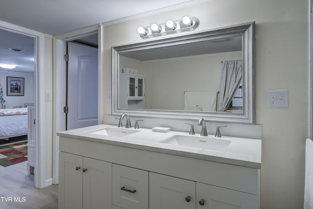 103 Dogwood Ln, Johnson City, TN 37604 - ensuite bathroom featuring wood finished floors, a sink, double vanity, and ensuite bathroom
