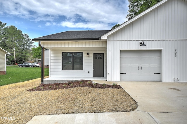 703 Swadley Rd Unit 1, Johnson City, TN 37601 - view of front of property with a shingled roof, concrete driveway, an attached garage, covered porch, and a front yard