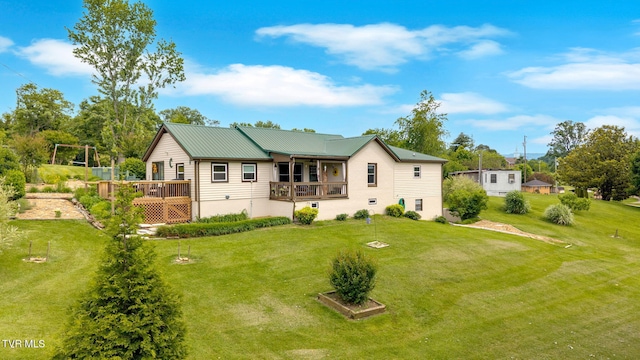 20 Chuckey College St, Chuckey, TN 37641 - rear view of house featuring a yard, metal roof, and a deck