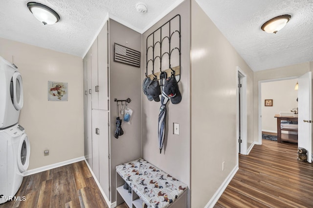 20 Chuckey College St, Chuckey, TN 37641 - laundry area with stacked washer and clothes dryer, a textured ceiling, wood finished floors, and baseboards