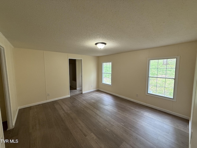 136 Gentry Mountain Rd, Erwin, TN 37650 - unfurnished room with baseboards, dark wood-style flooring, and a textured ceiling