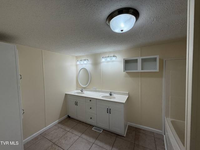 136 Gentry Mountain Rd, Erwin, TN 37650 - bathroom featuring a sink, tile patterned flooring, and a textured ceiling