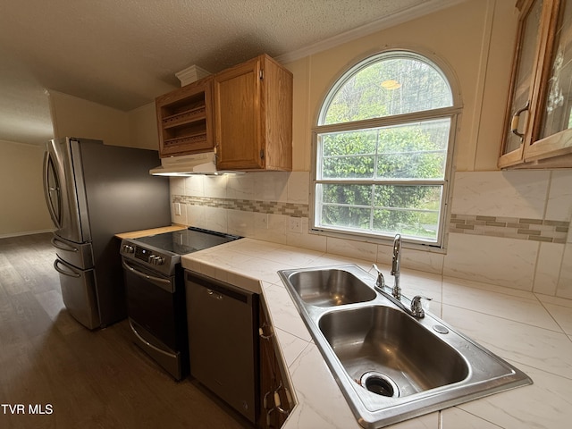 136 Gentry Mountain Rd, Erwin, TN 37650 - kitchen with tile countertops, brown cabinets, a sink, under cabinet range hood, and stainless steel appliances