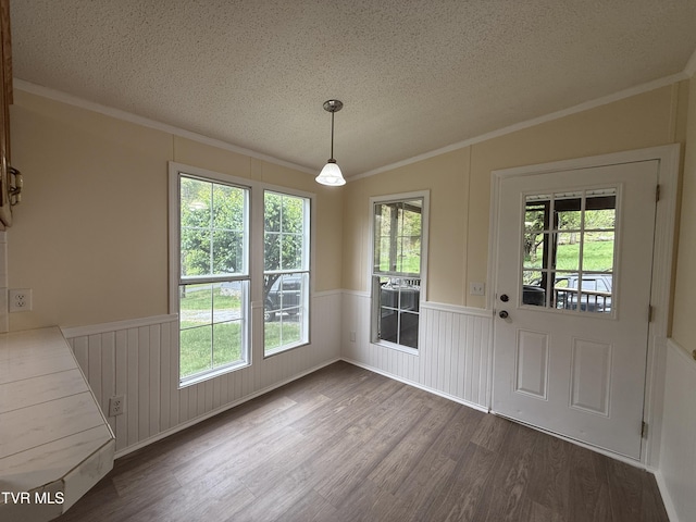 136 Gentry Mountain Rd, Erwin, TN 37650 - unfurnished dining area with a textured ceiling, ornamental molding, and dark wood-type flooring