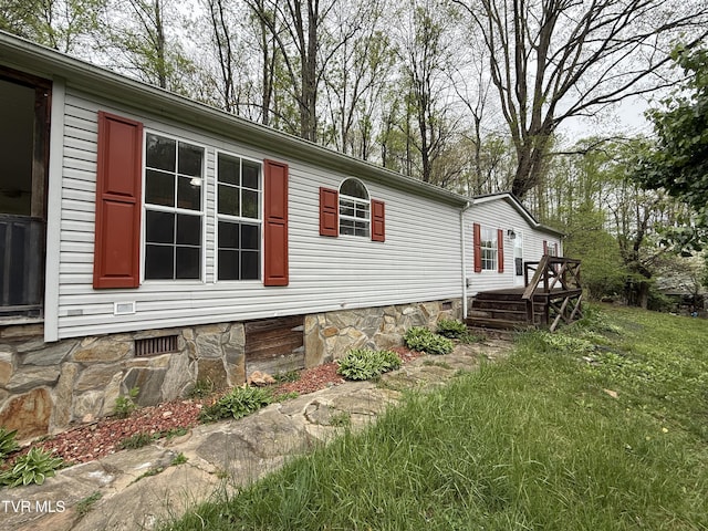 136 Gentry Mountain Rd, Erwin, TN 37650 - view of side of property with a yard, crawl space, and a deck