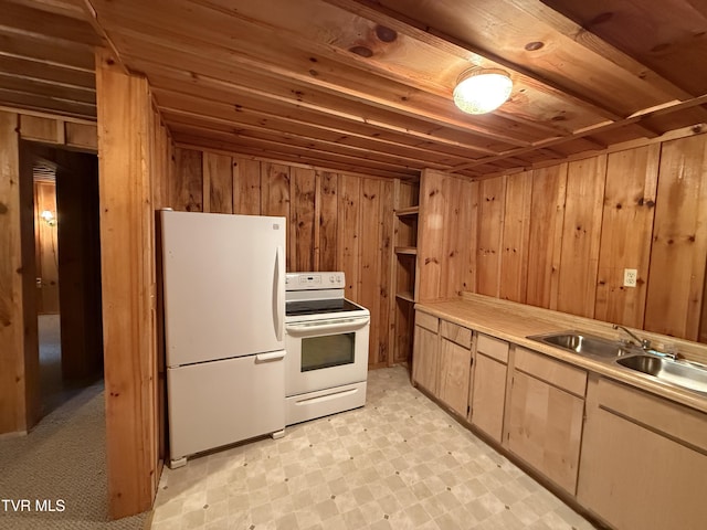 136 Gentry Mountain Rd, Erwin, TN 37650 - kitchen featuring a sink, light countertops, wooden walls, light floors, and white appliances