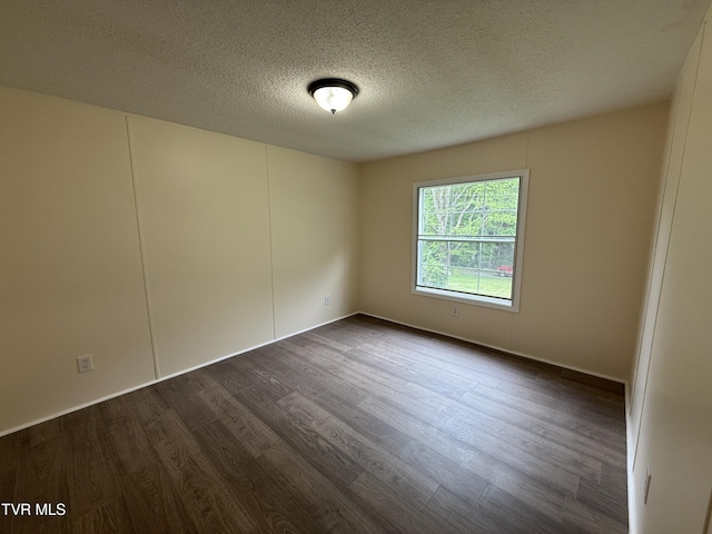 136 Gentry Mountain Rd, Erwin, TN 37650 - empty room with a textured ceiling and dark wood finished floors