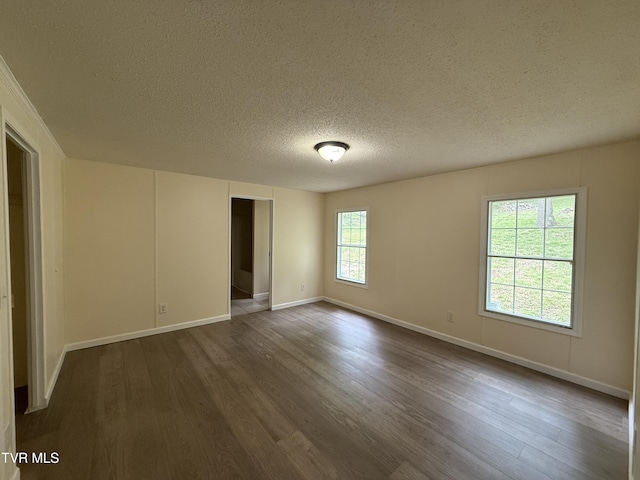 136 Gentry Mountain Rd, Erwin, TN 37650 - empty room with a textured ceiling, baseboards, and dark wood-type flooring