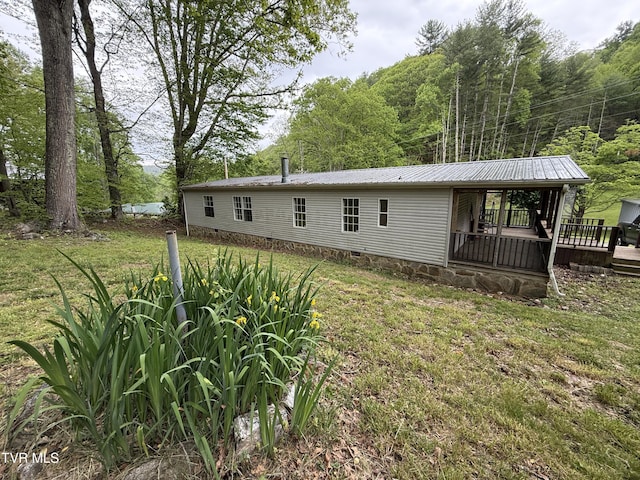 136 Gentry Mountain Rd, Erwin, TN 37650 - rear view of property with a lawn, a forest view, crawl space, and metal roof