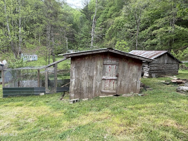 136 Gentry Mountain Rd, Erwin, TN 37650 - view of shed featuring a forest view