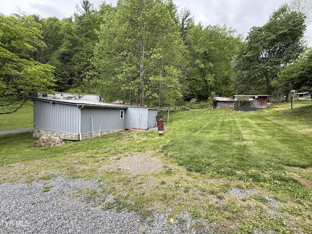 136 Gentry Mountain Rd, Erwin, TN 37650 - view of yard with an outbuilding and a forest view
