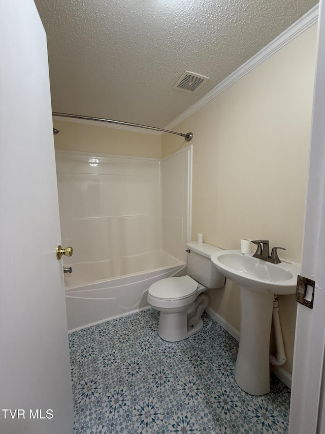 136 Gentry Mountain Rd, Erwin, TN 37650 - full bath featuring visible vents, ornamental molding, toilet, a textured ceiling, and shower / bathing tub combination
