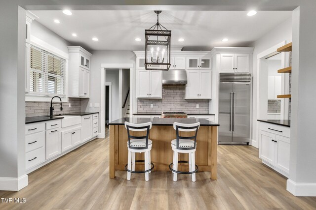 14737 Washington Way, Bristol, VA 24202 - kitchen with dark countertops, built in refrigerator, and decorative backsplash