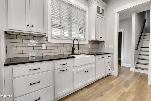 14737 Washington Way, Bristol, VA 24202 - kitchen with a sink, dark countertops, and backsplash